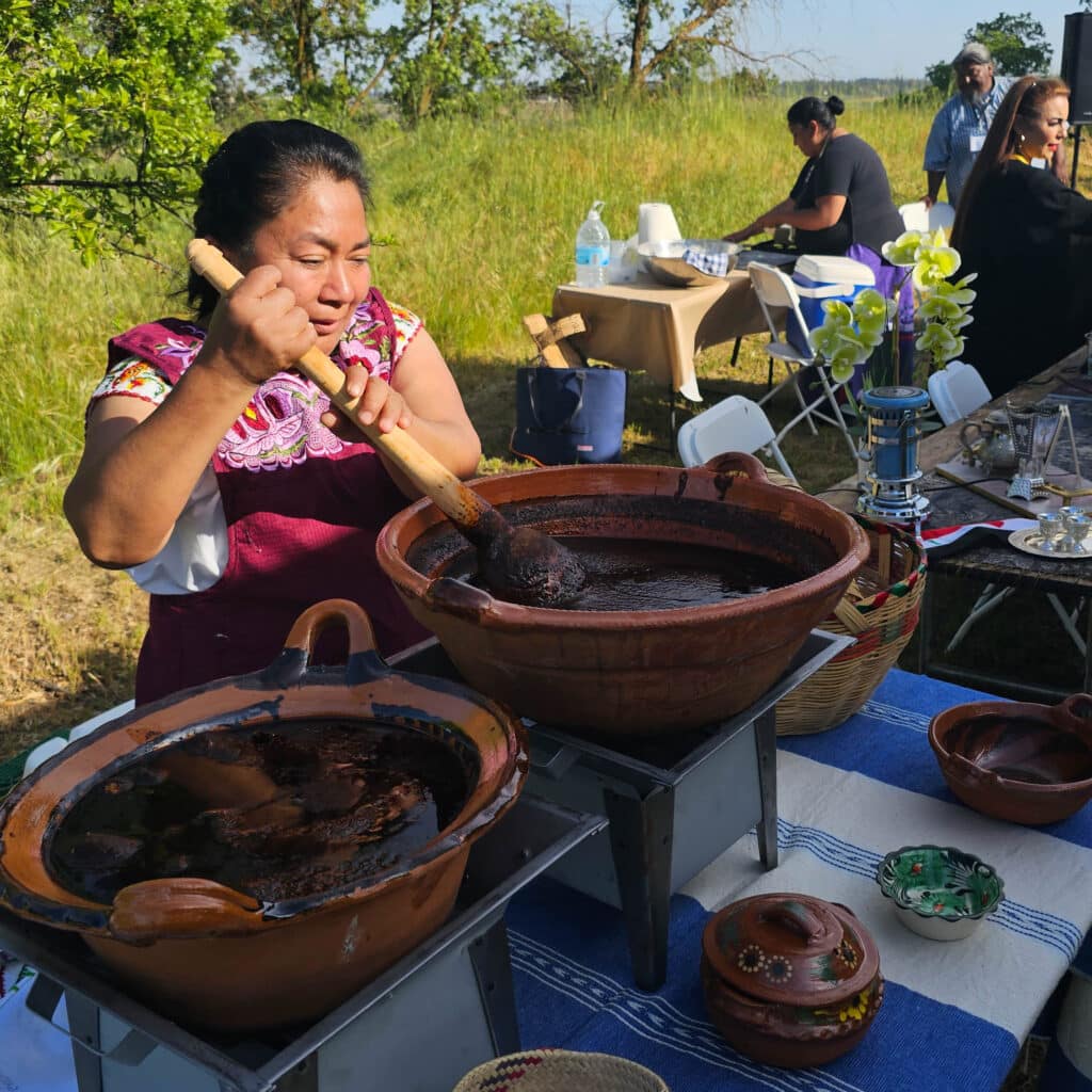 woman hand-making mole at outdoor table